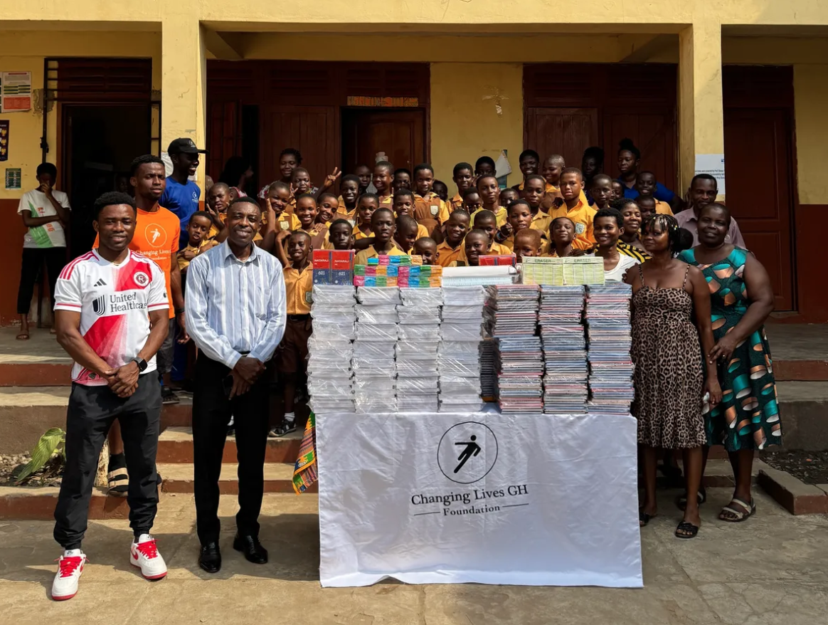 A group poses for a photo during the CleanPlay event hosted by Changing Lives GH 